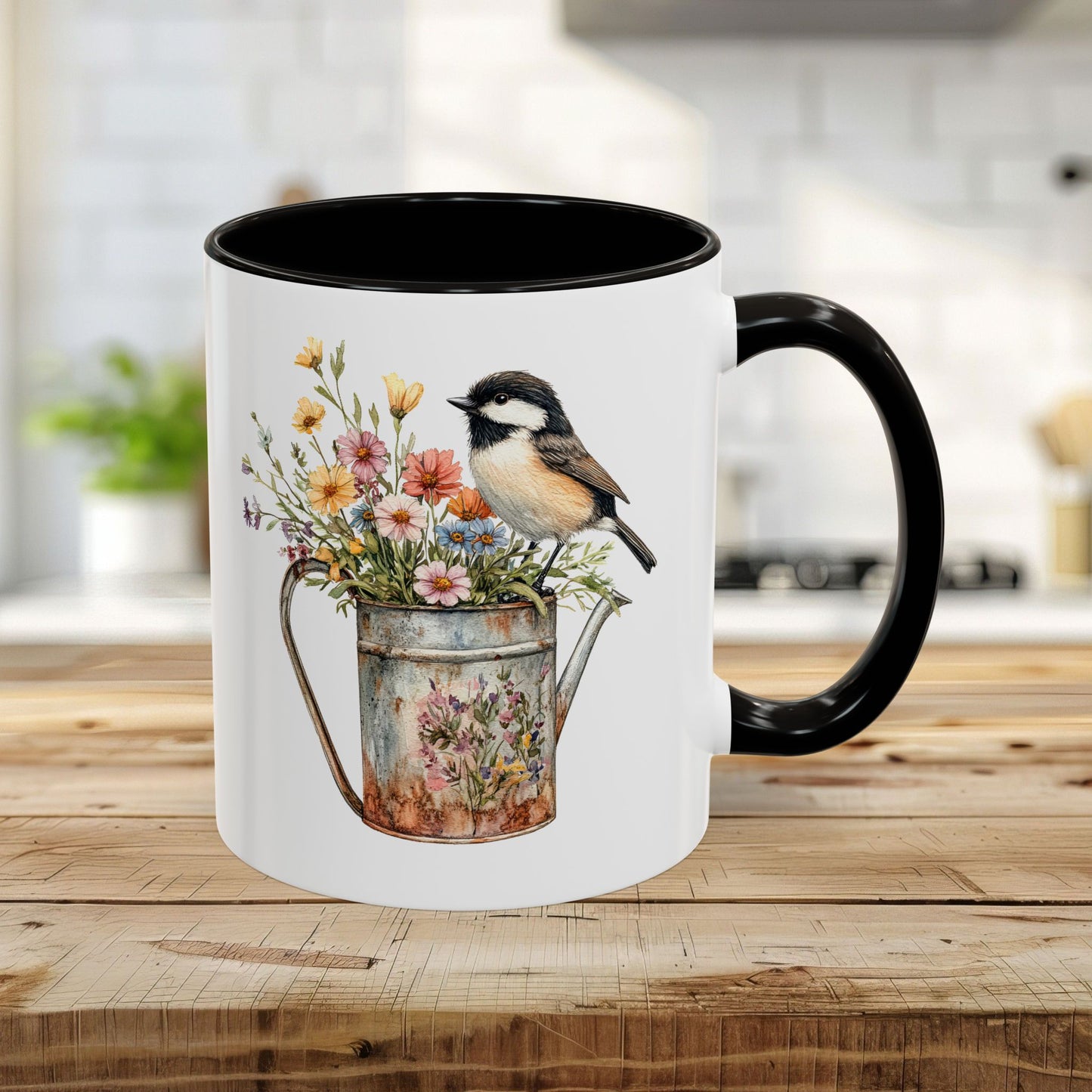 White ceramic mug with black interior and handle, featuring a watercolor chickadee on a floral watering can.