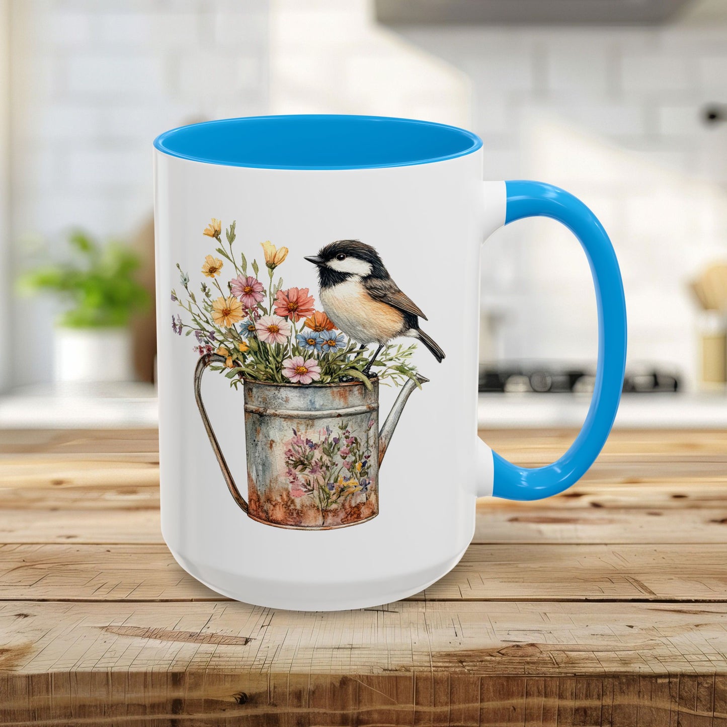 15oz white ceramic mug with light blue interior and handle, featuring a chickadee on a floral watering can.