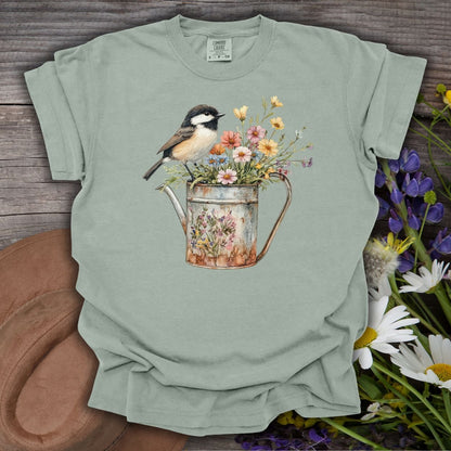 Bay S garment-dyed cotton t-shirt with a chickadee perched on a floral watering can.