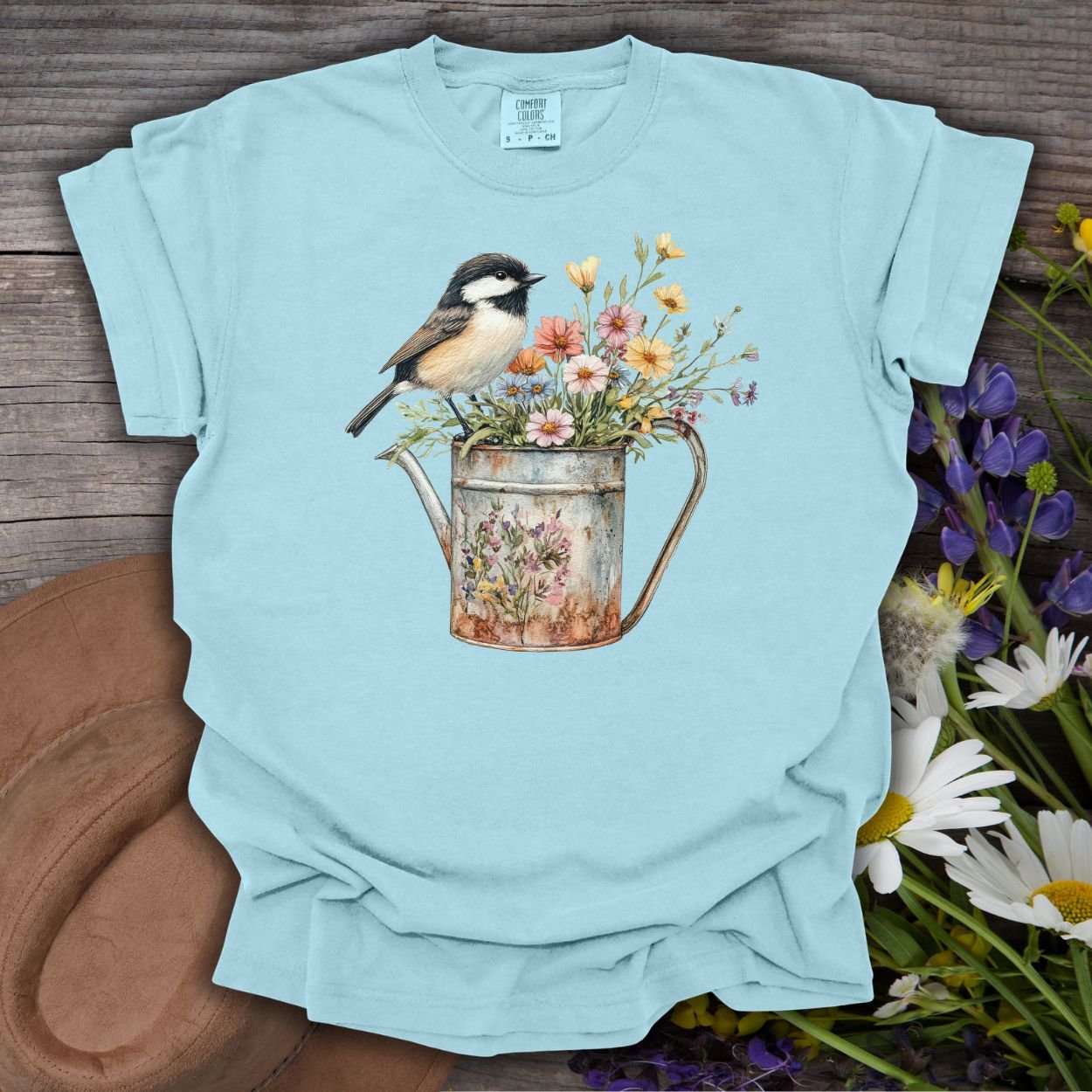 Chambray S t-shirt with a chickadee perched on a floral watering can.