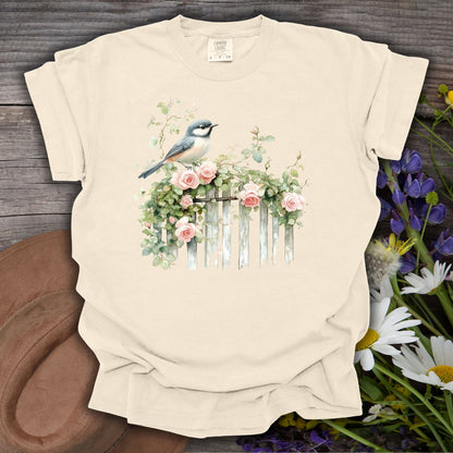 Ivory S t-shirt with a watercolor chickadee on a rose-covered garden fence.