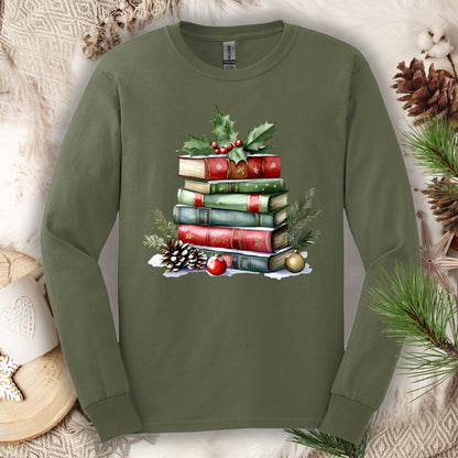 Military Green long sleeve tee with a watercolor Christmas book stack, holly, pinecones, and ornaments.