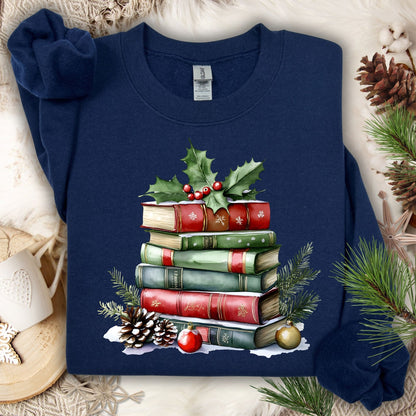 Navy Gildan sweatshirt with a watercolor stack of Christmas books, holly, pinecones, and ornaments.
