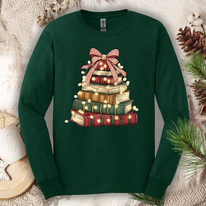 Forest Green long sleeve tee with a watercolor Christmas book tree design, topped with a plaid bow and string lights.