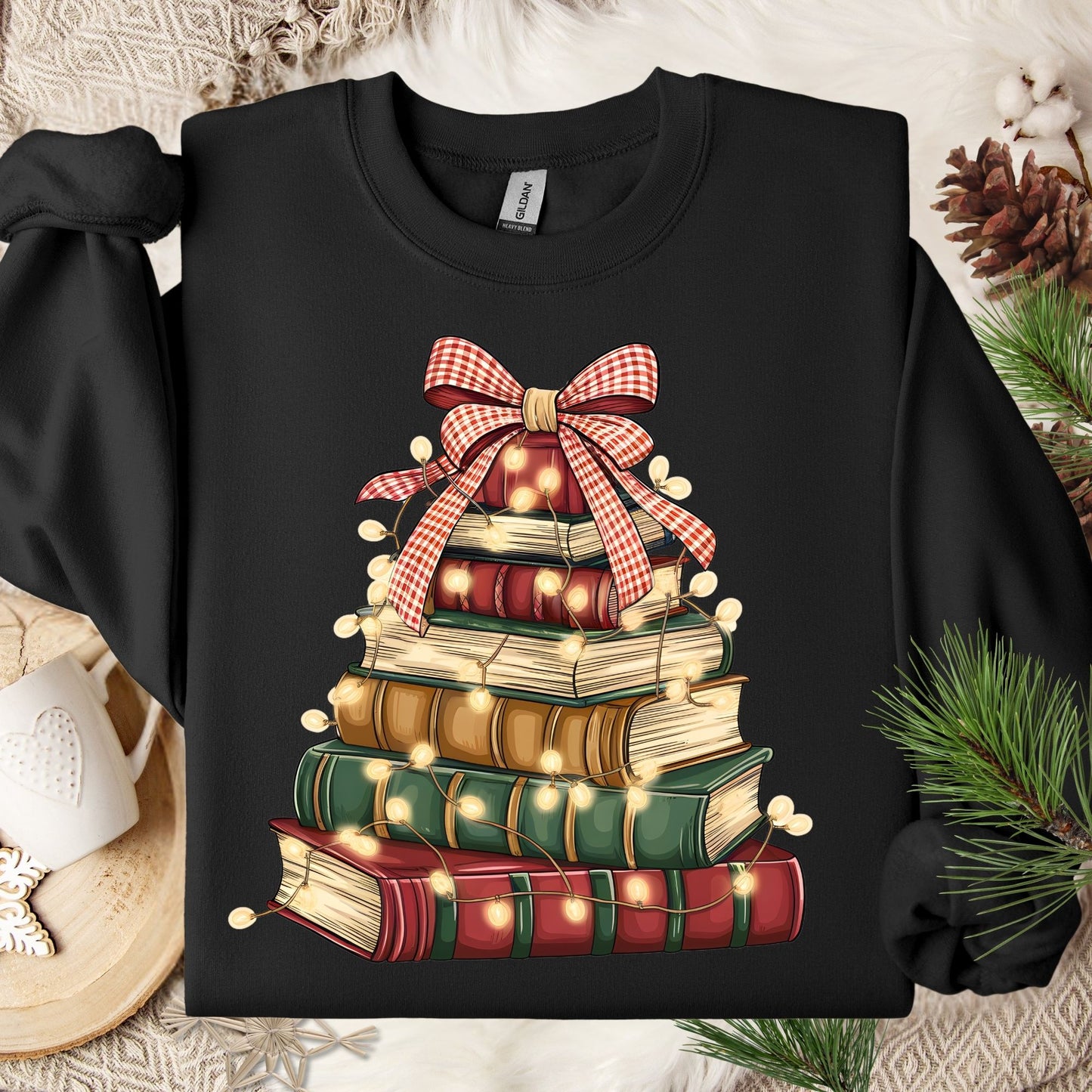 Black Gildan sweatshirt with a vintage book Christmas tree design, glowing lights, and a red gingham bow.