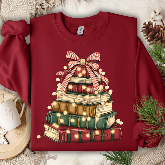 Cardinal Red fleece sweatshirt with a vintage book Christmas tree design and glowing lights.