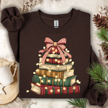 Dark chocolate sweatshirt with a vintage book Christmas tree design, glowing lights, and a plaid bow.