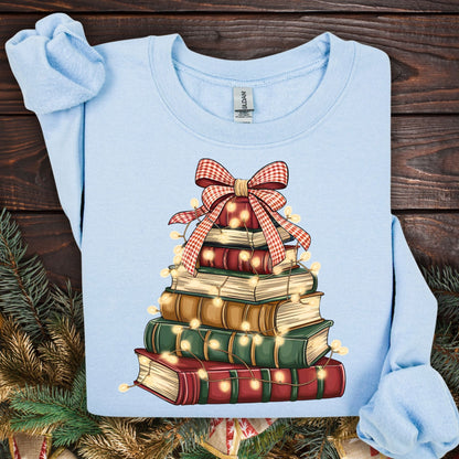 Light blue Gildan sweatshirt with a vintage watercolor book tree design, festive lights, and a plaid bow.
