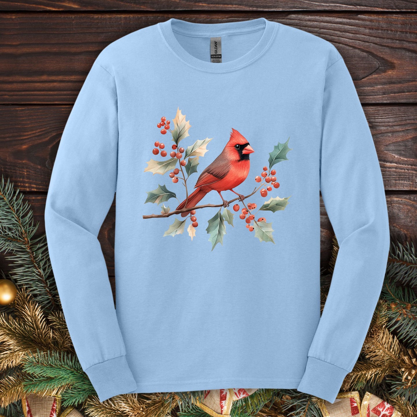Light blue Gildan long sleeve tee with watercolor red cardinal on a holly branch design.