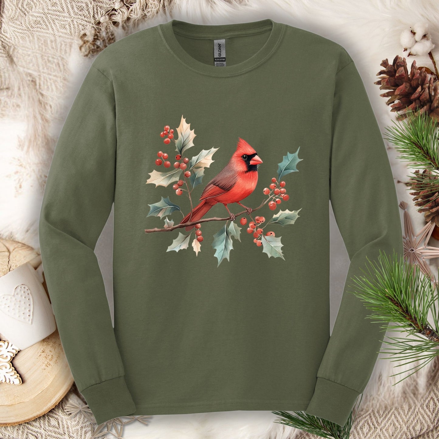 Military Green Gildan long sleeve tee with a watercolor red cardinal on a holly branch design.