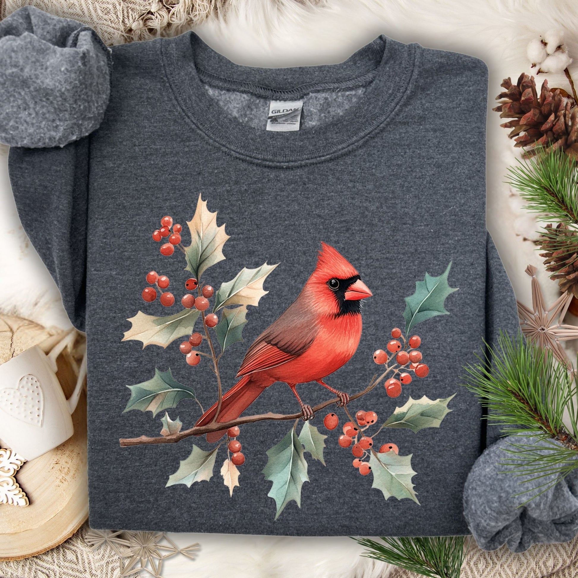 Charcoal gray crewneck sweatshirt with a vibrant red cardinal perched on holly branches with red berries.