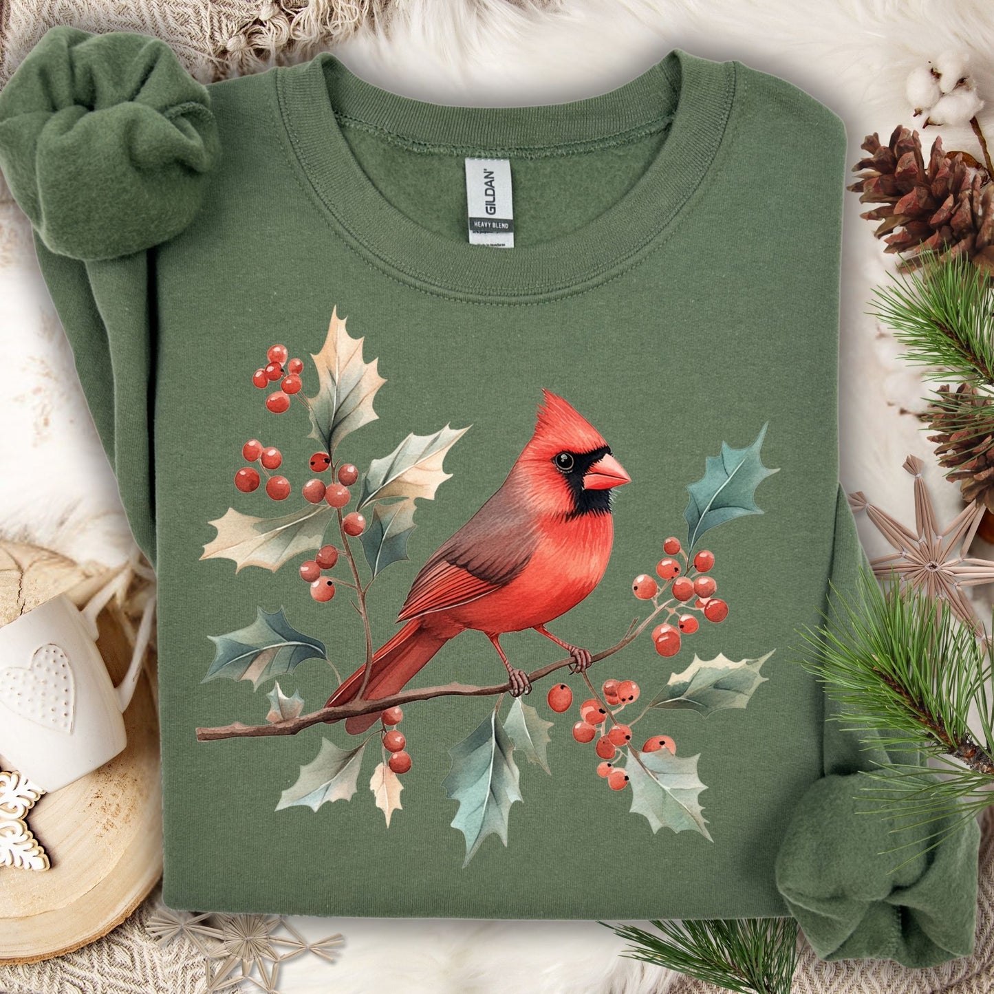Military Green S sweatshirt with a red cardinal on holly branches design, made from a cotton/polyester blend.