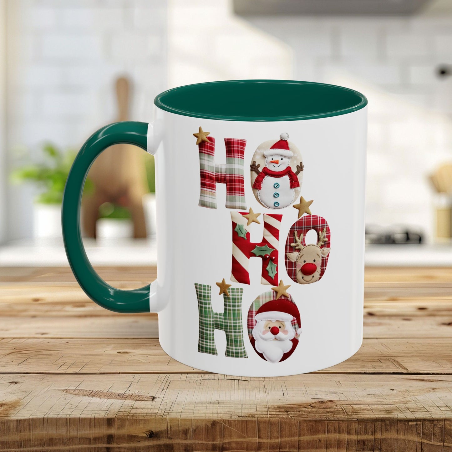 White ceramic Christmas mug with a green handle and interior, featuring "Ho Ho Ho" typography with plaid, candy-cane, and woodland textures, each letter inhabited by tiny seasonal characters.