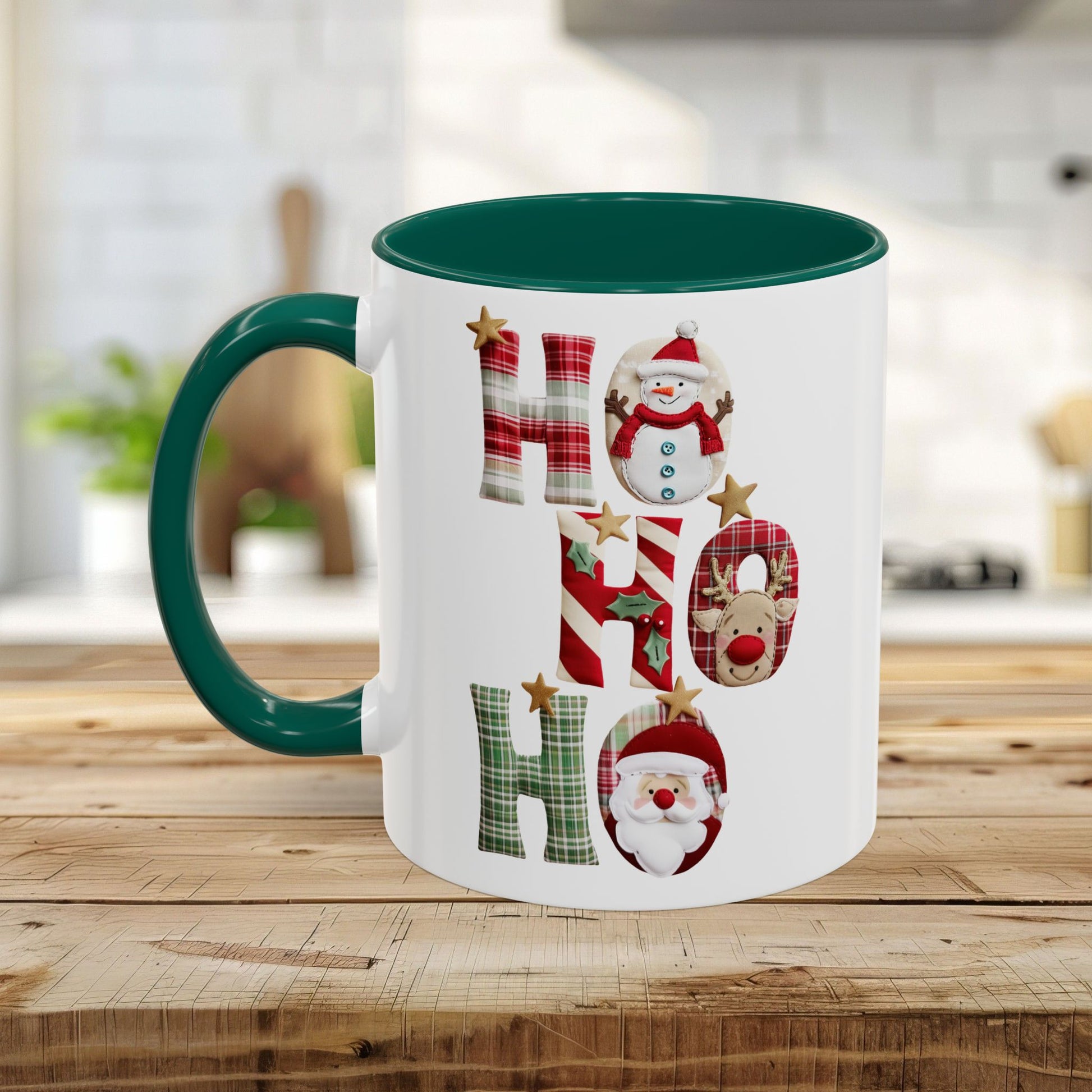 White ceramic Christmas mug with a green handle and interior, featuring "Ho Ho Ho" typography with plaid, candy-cane, and woodland textures, each letter inhabited by tiny seasonal characters.