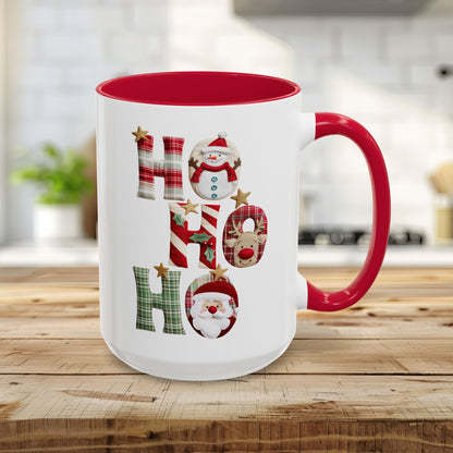 15oz white ceramic mug with red interior and handle, featuring "Ho Ho Ho" in plaid, candy-cane, and woodland textures with Santa, snowman, and reindeer characters.