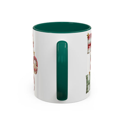 White ceramic mug with green interior and handle, featuring "Ho Ho Ho" in plaid, candy-cane, and woodland textures.