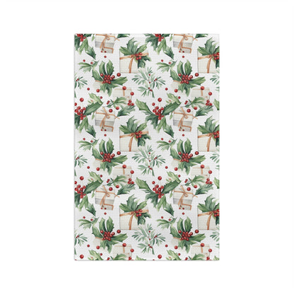 White microfiber tea towel with watercolor holly, red berries, and wrapped gifts.