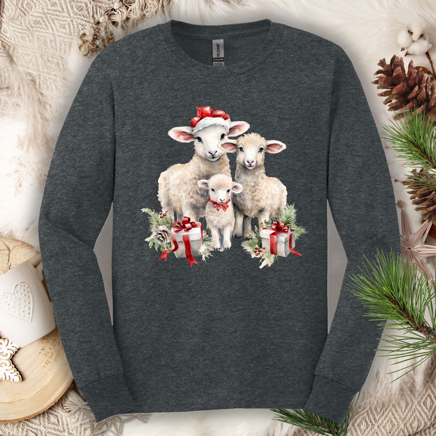 Dark Heather Gildan long sleeve tee with watercolor Christmas lambs in Santa hats and gifts.