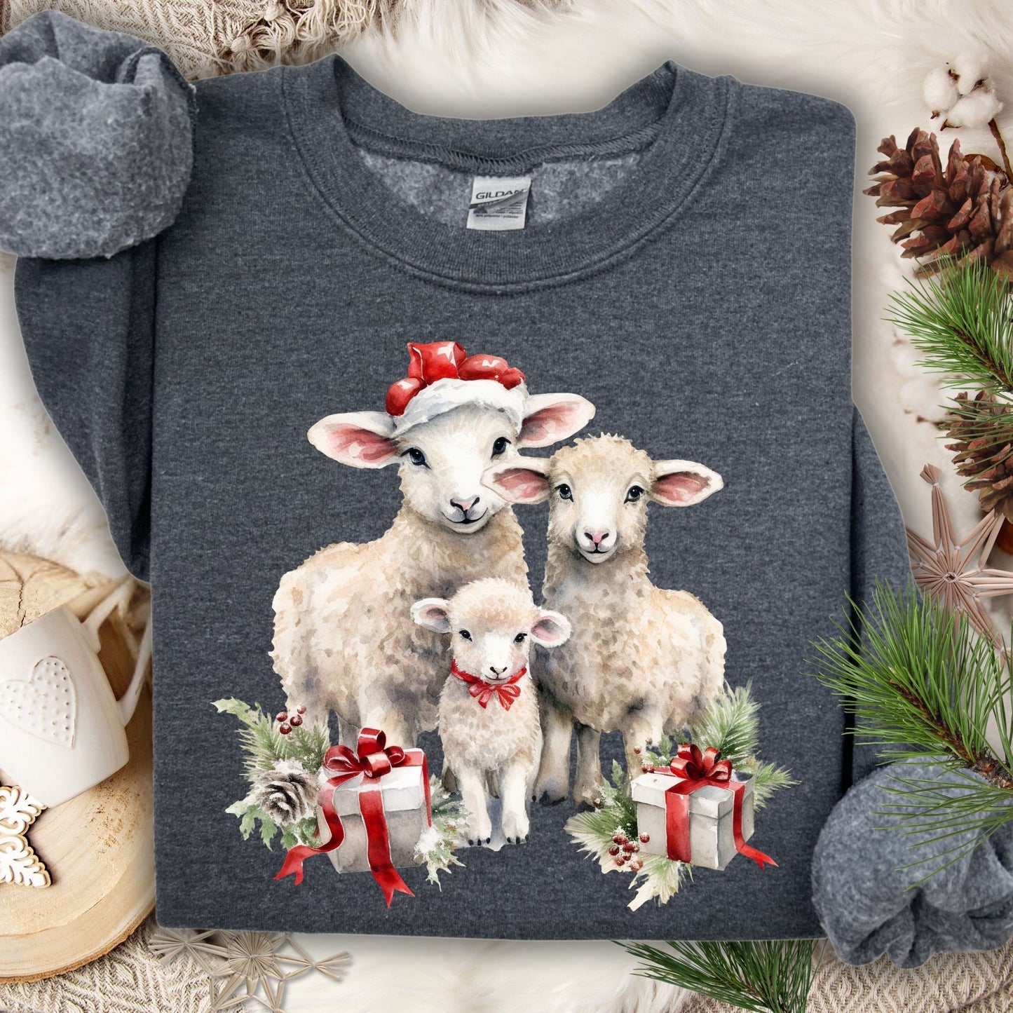 Dark gray crewneck sweatshirt with three watercolor lambs in Santa hats and gifts.