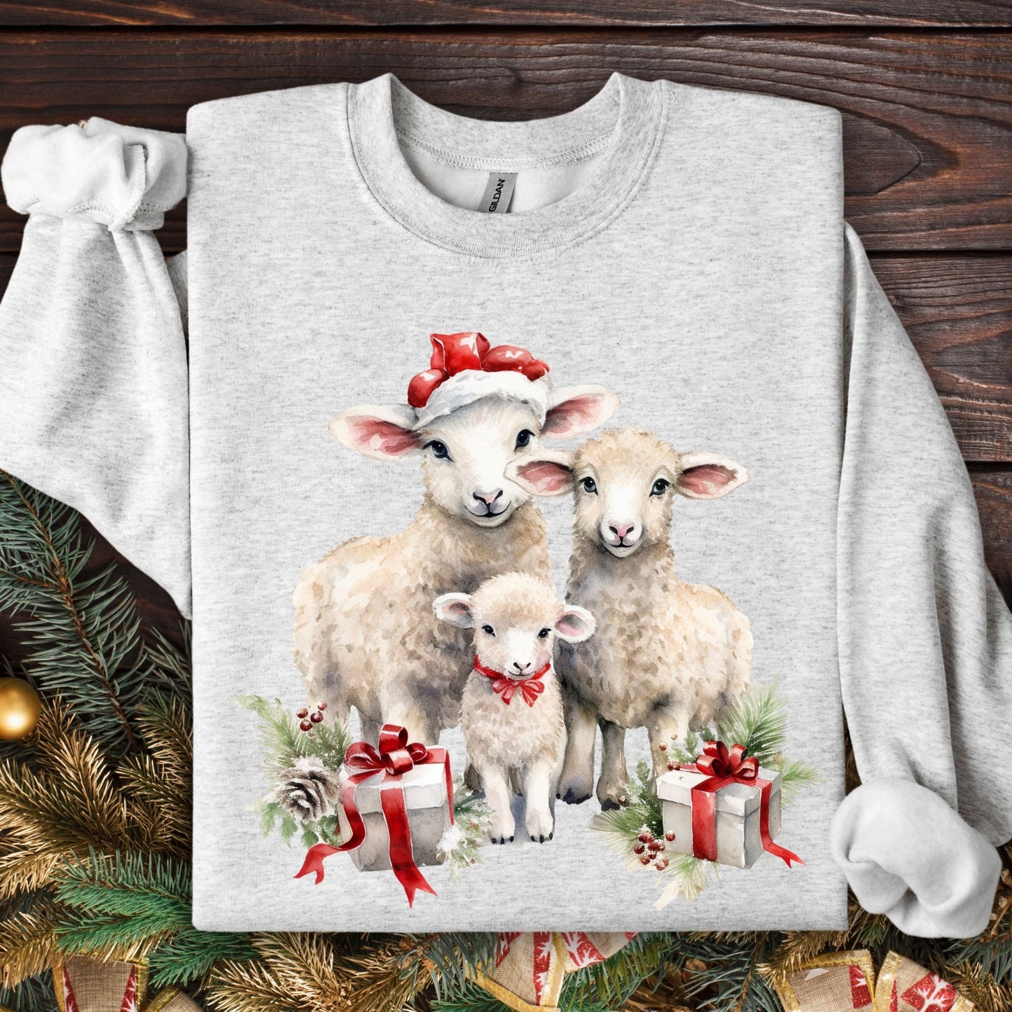 Ash gray crewneck sweatshirt with three watercolor lambs in Santa hats and gifts.