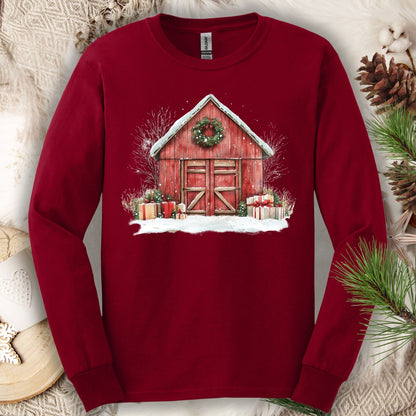 Cardinal Red Gildan Softstyle long sleeve tee with watercolor red barn, snow, gifts, and wreath.