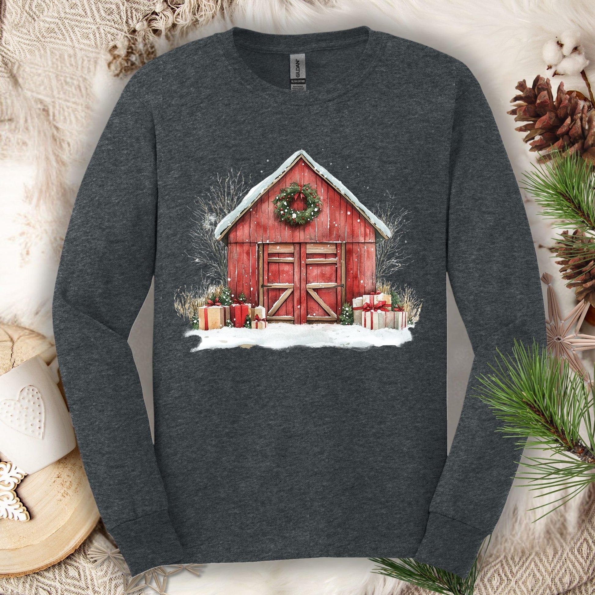 Dark Heather Gildan Softstyle long sleeve tee with watercolor red barn, snow, gifts, and wreath.