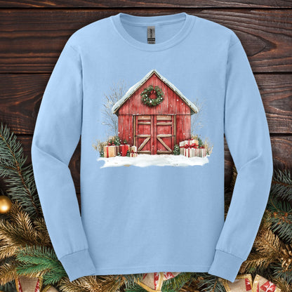 Light blue Gildan Softstyle long sleeve tee with watercolor red barn, snow, gifts, and wreath design.