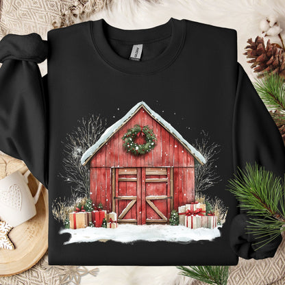 Black Gildan sweatshirt with a watercolor red barn, snow, wreath, and gifts.