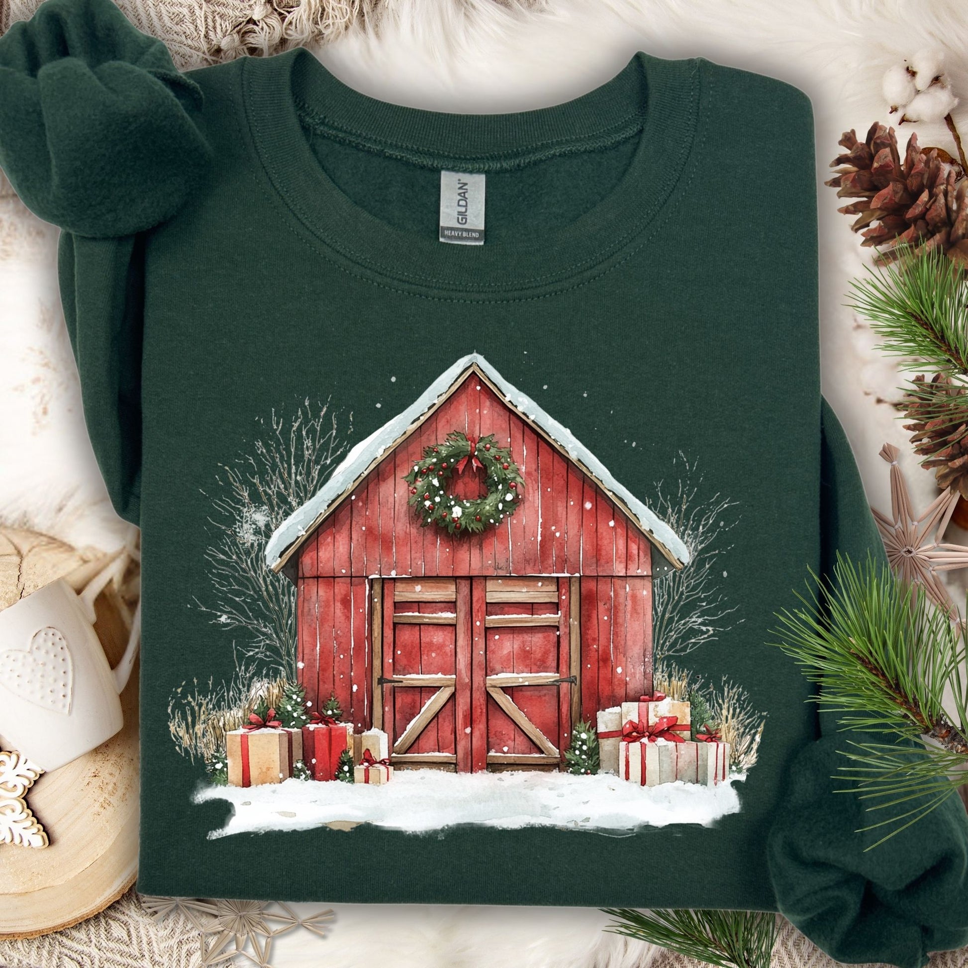 Forest Green Gildan sweatshirt with a vintage watercolor red barn, snow, wreath, and gifts.