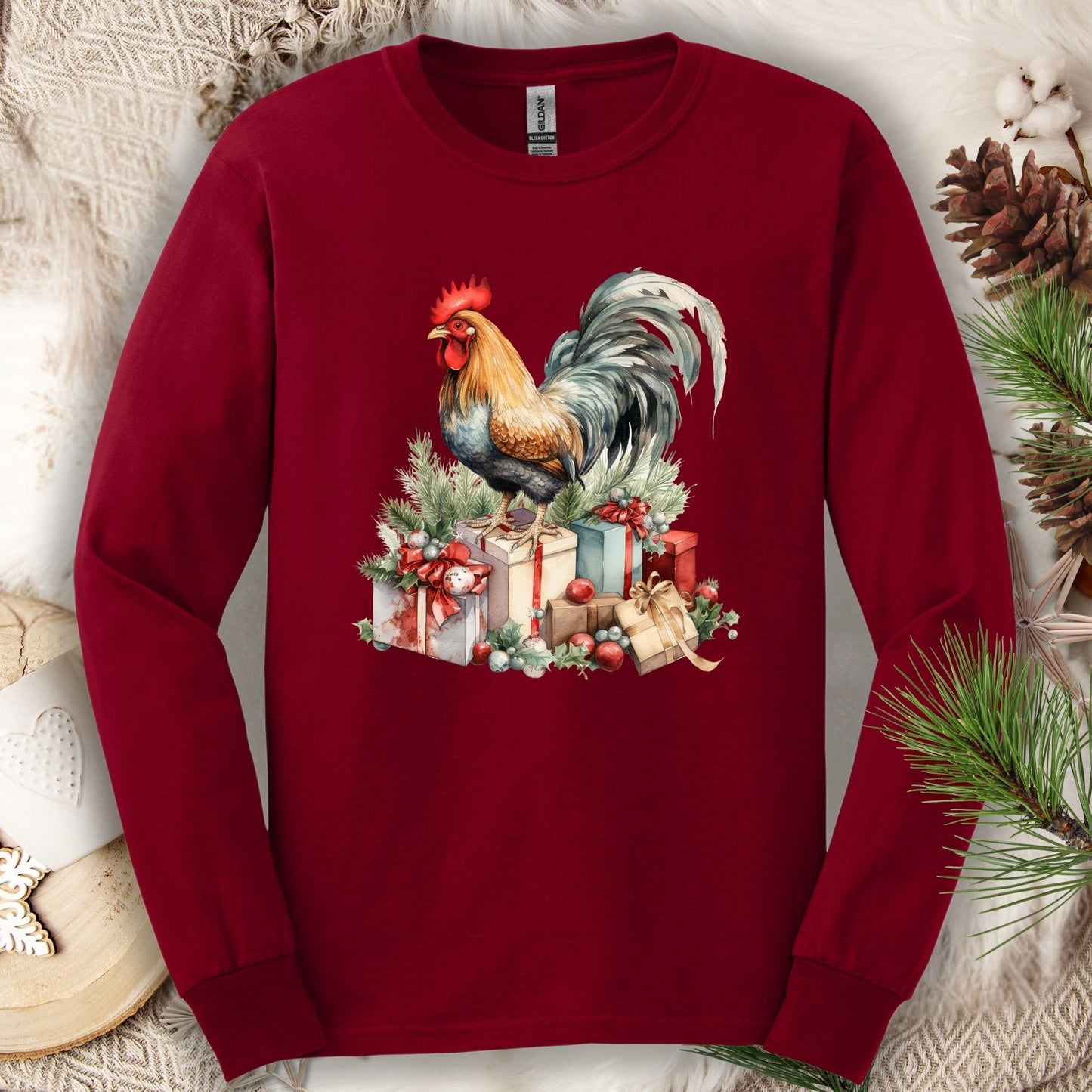 Cardinal Red Gildan long sleeve tee with a watercolor rooster on Christmas presents.