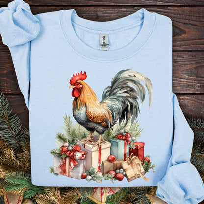 Light blue Gildan Christmas Rooster Sweatshirt, size S, with a watercolor rooster on festive gifts and pine.
