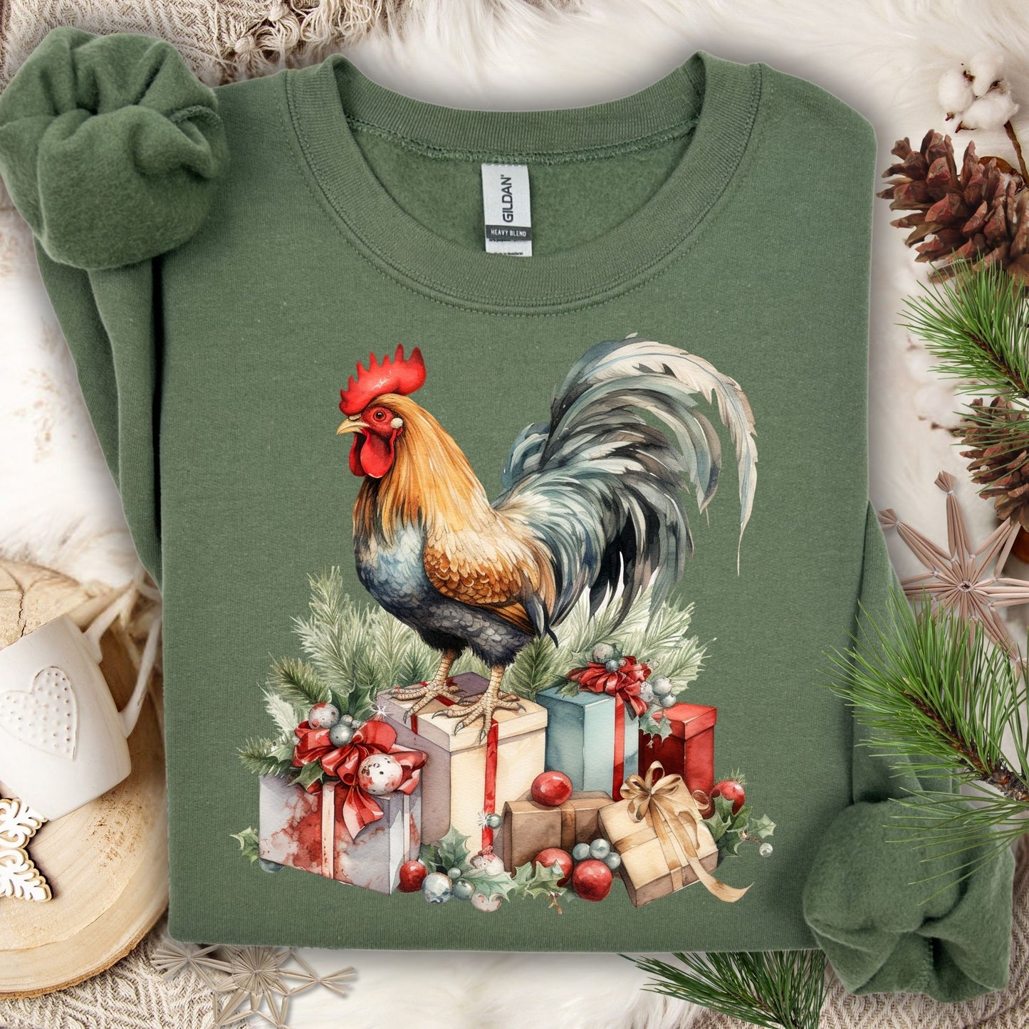 Military Green Gildan sweatshirt with a watercolor Christmas rooster on gifts, surrounded by pine and holly.