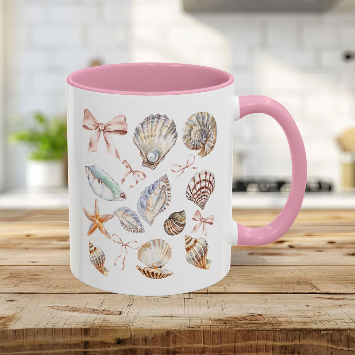 11oz white ceramic mug with pink interior/handle and watercolor seashells, starfish, and bows.