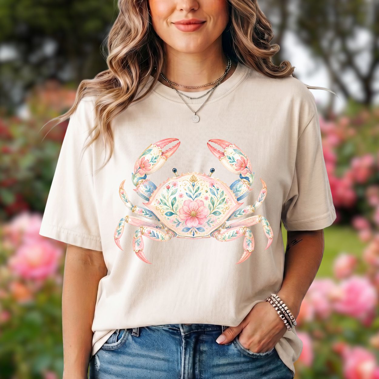 Relaxed-fit, garment-dyed t-shirt with a watercolor floral crab design in pastel tones.
