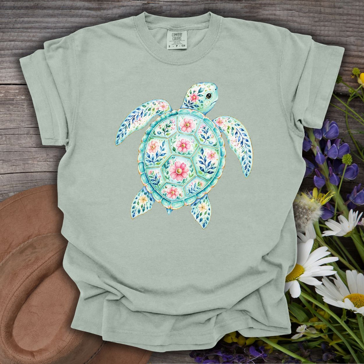 Bay green relaxed-fit t-shirt with a watercolor floral sea turtle design.