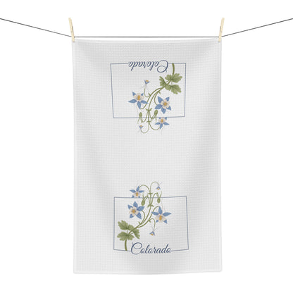White microfiber tea towel with two framed blue columbine floral designs and "Colorado" text.