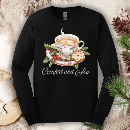 Black heavyweight cotton long sleeve tee with watercolor teacup, evergreens, gingerbread, and "Comfort and Joy" text.