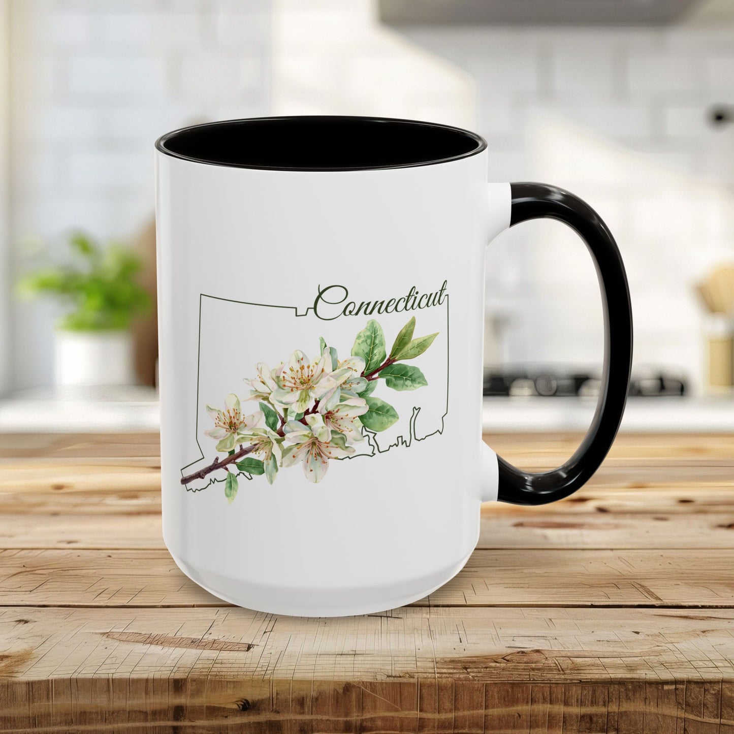 15oz white ceramic mug with black interior/handle, featuring a watercolor Mountain Laurel over a Connecticut outline.