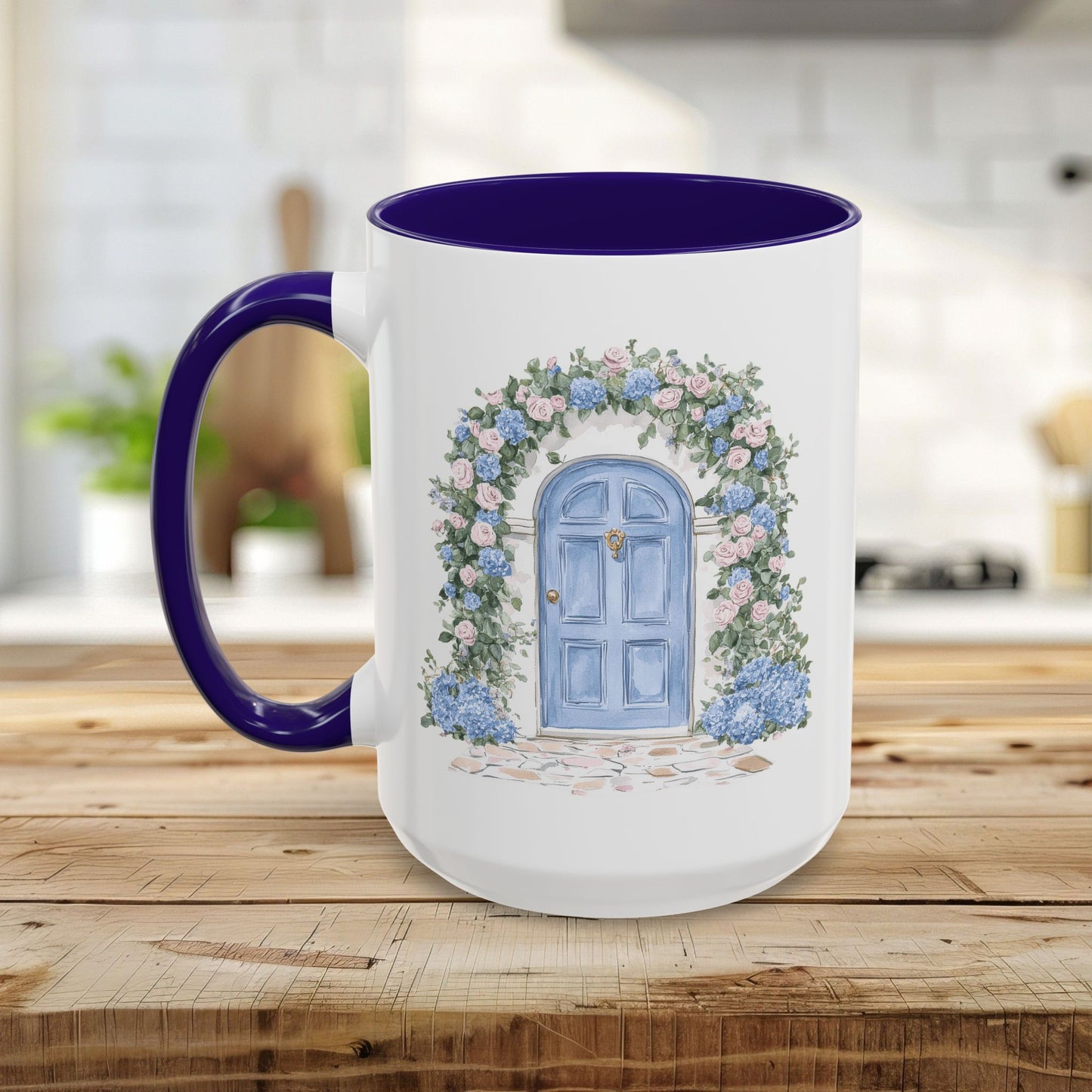 White ceramic mug with a blue door and pink/blue floral arch, purple handle and interior.