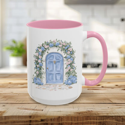 15oz ceramic mug with pink interior/handle, featuring a hand-painted blue doorway framed by pink roses and blue hydrangeas.