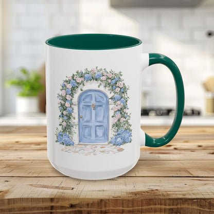 15oz white ceramic mug with green interior/handle and a watercolor blue door framed by pink roses and blue hydrangeas.