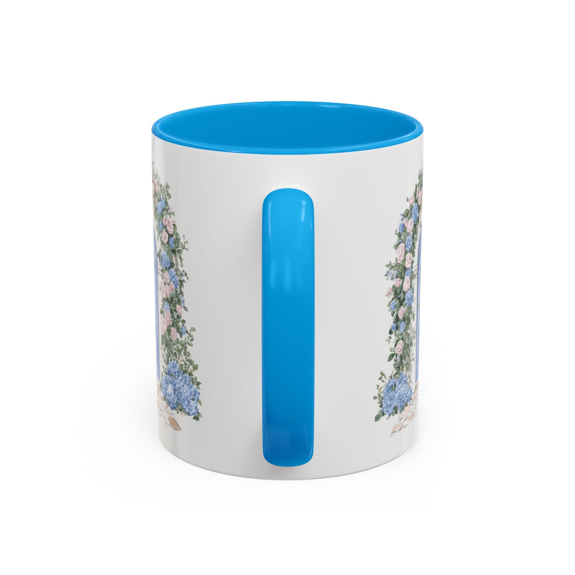 White ceramic mug with blue interior and handle, featuring a watercolor cottage doorway with hydrangeas.