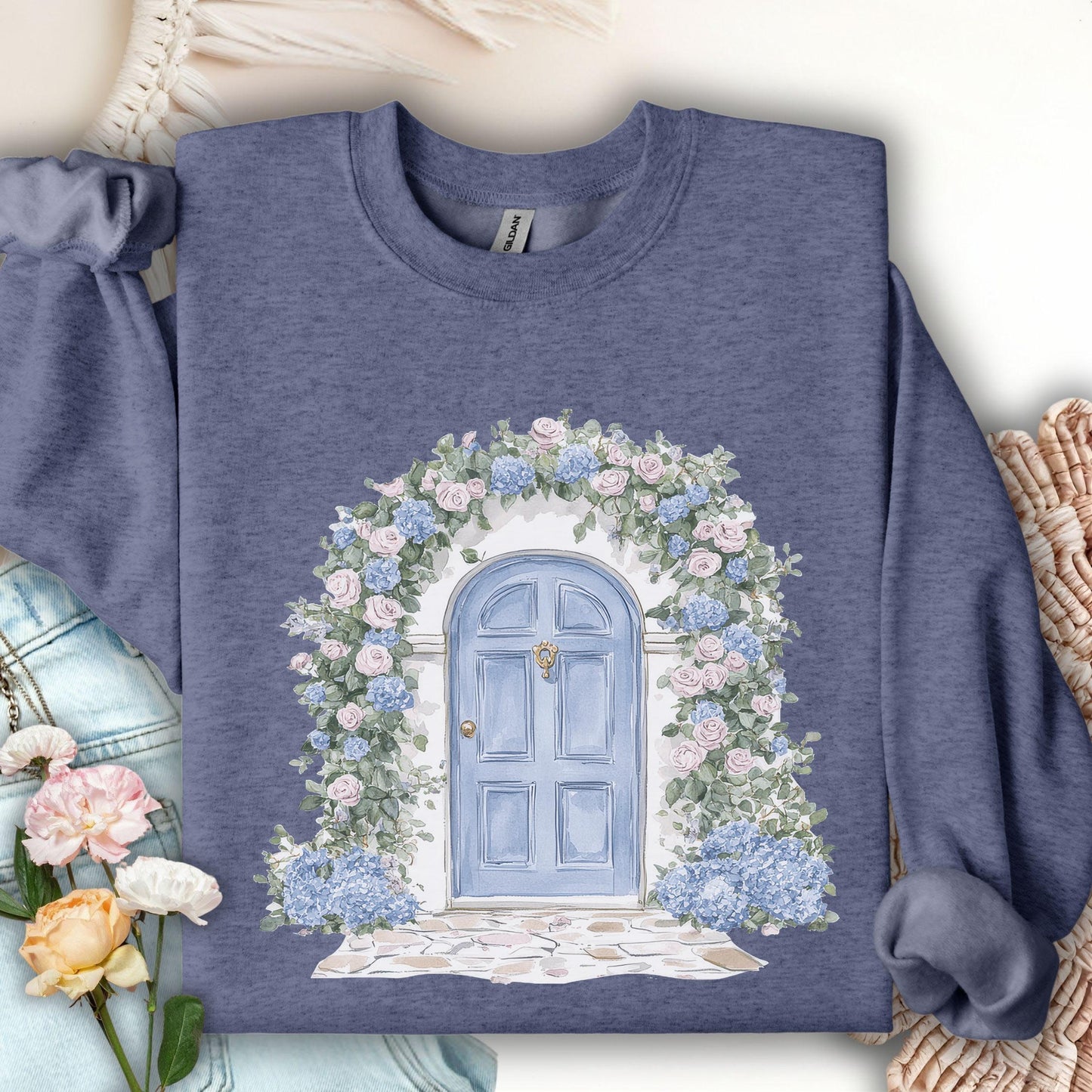 Heather Sport Dark Navy sweatshirt with watercolor cottage doorway, blue door, and pink/blue hydrangeas.