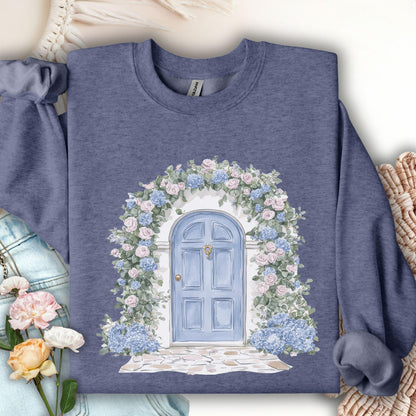 Heather Sport Dark Navy sweatshirt with watercolor cottage doorway, blue door, and pink/blue hydrangeas.