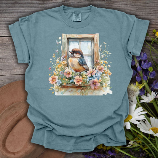 Ice Blue cottagecore t-shirt with a watercolor bluebird on a floral windowsill design.