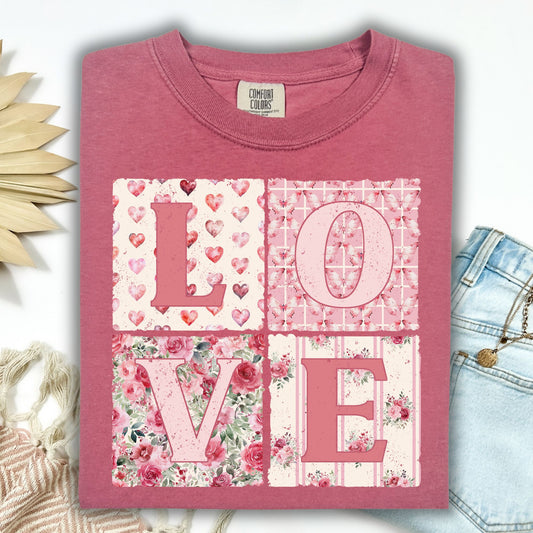 Brick cottagecore t-shirt with "LOVE" in patchwork quilt letters featuring hearts, florals, and stripes.