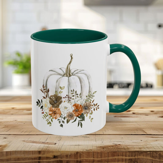 11 oz glossy ceramic mug with a green handle and interior, featuring a watercolor white pumpkin and autumn florals.