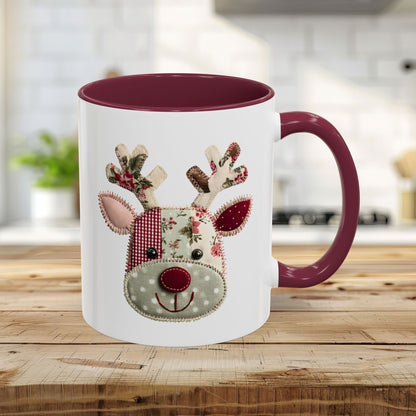 11oz ceramic mug with a maroon handle/interior and a patchwork Rudolph design.