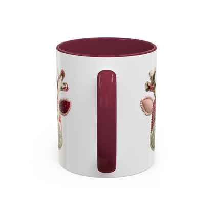 White ceramic mug with a maroon interior and handle, featuring a patchwork Rudolph design.
