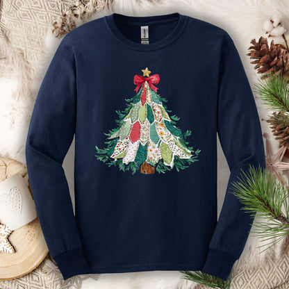 Navy long sleeve tee with a printed country-style quilted Christmas tree design, featuring rustic patterns and warm colors.